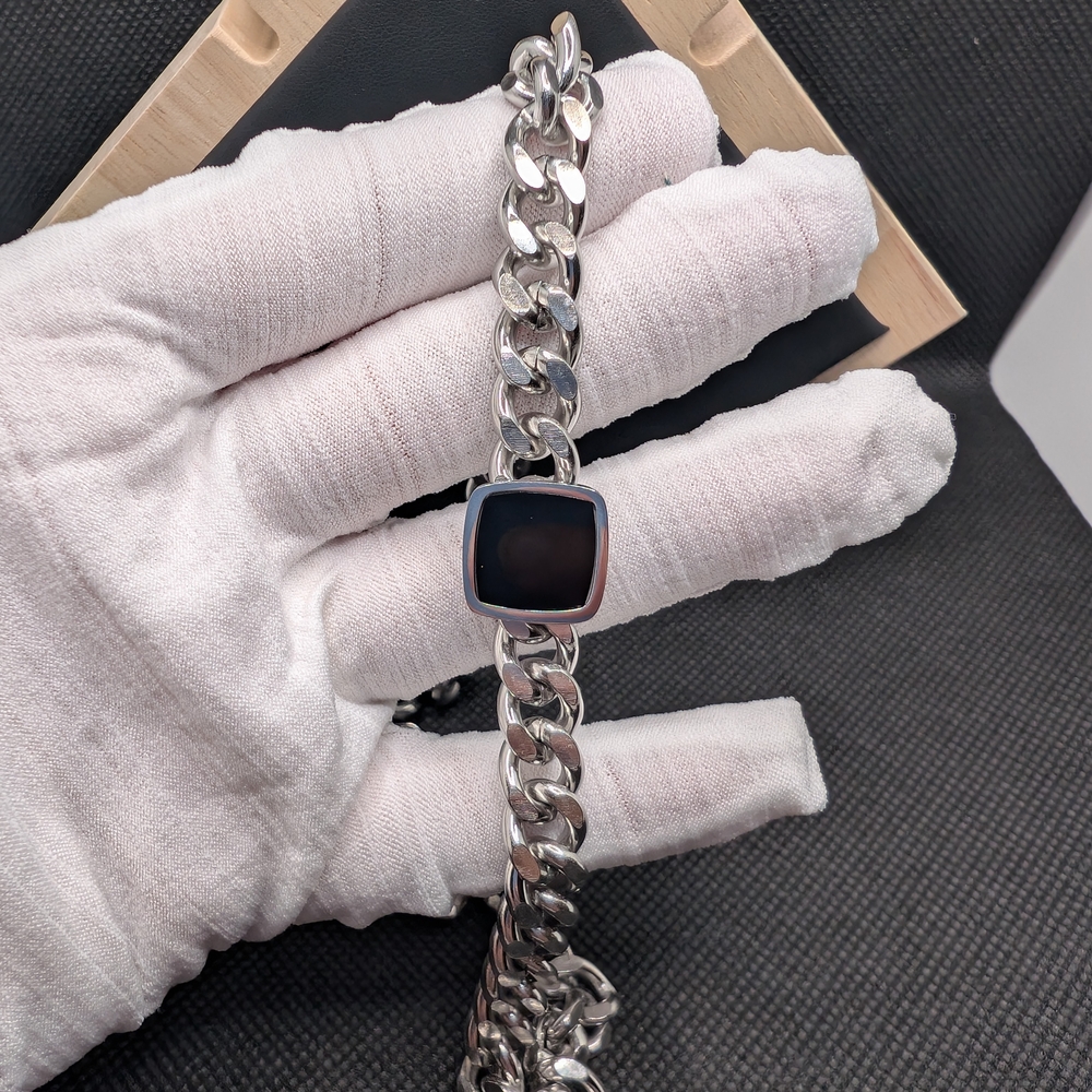 Stainless Steel Chain Bracelet with Black Accent.